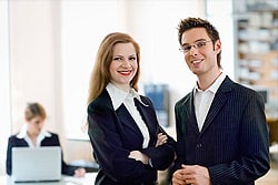 Male And Female Dressed In Business Attire