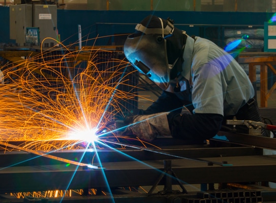 A welder at work in a factory