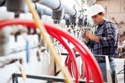 Industrial piping engineer worker at manufacturing facility