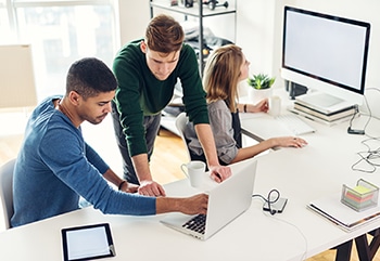 Technical writers working on a support document