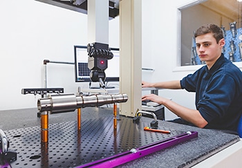 Machine Designer Working on a Measuring Machine