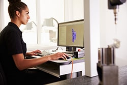 Female Mold Designer Working on a CAD System