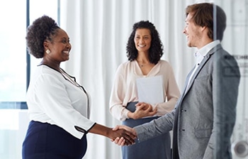 Interviewers Welcoming a Successful Candidate To The Team