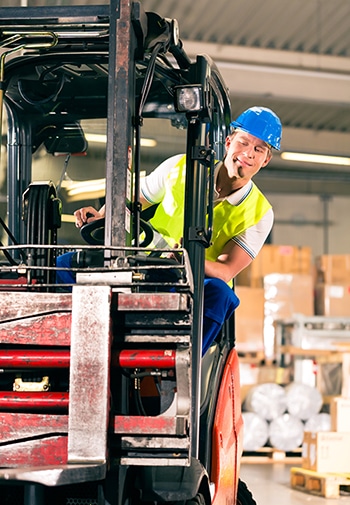 Forklift Operator at a Warehouse Lifting Items