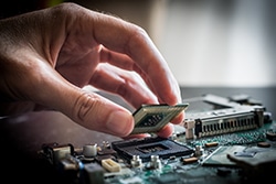 A Person Assembling a Circuit Board