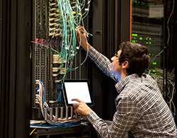 A Man Working On a Server