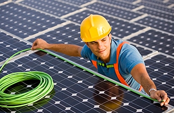 Solar Engineer Measuring The Length of a Solar Panel