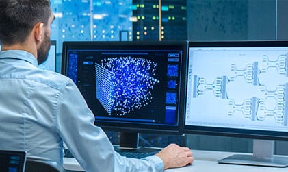 Data specialist reviewing analytics and system architecture to support IT and technical staffing needs.