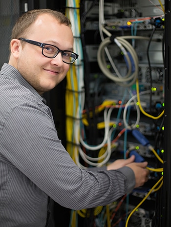 An electrical engineer monitoring a networking system